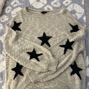 tan and black star sweater, size small